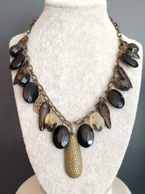 Textured brass and hanging black bead necklace
